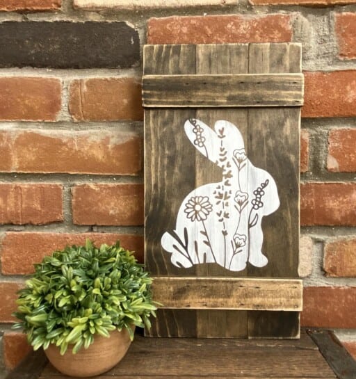 Adorable wooden bunny sign decorated with sweet wildflowers. Shop unique spring decor on Etsy.