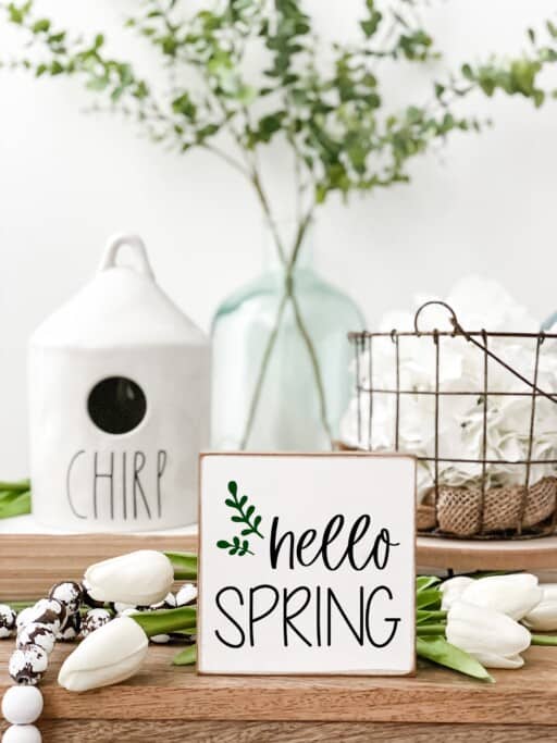 Rustic 'Hello Spring' wood sign adds a touch of seasonal charm to your decor. 