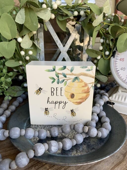 "Rustic 'Bee Happy' wood sign in a beehive box. Add a touch of spring & pollinator-friendly charm to your home.