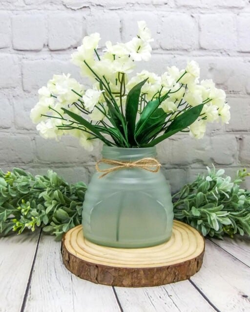 Frosted glass beehive jar filled with flowers for unique spring decor. Shop similar floral arrangements on Etsy.