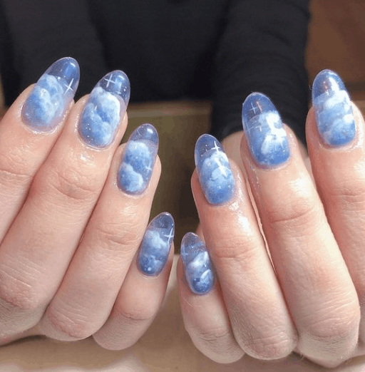 Beautiful cloud nail art and designs for a dreamy manicure: Blue See-Through Cloud Nails