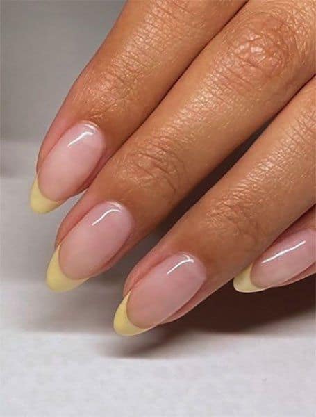 Trendy yellow nail designs for a sunny manicure: Soft Yellow Tips
