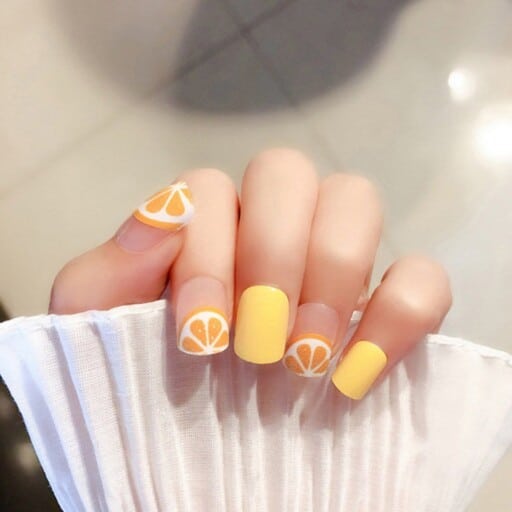 Trendy yellow nail designs for a sunny manicure: Orange Accent With Yellow