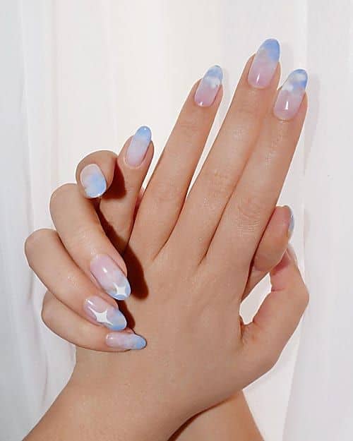 Beautiful cloud nail art and designs for a dreamy manicure: Clear To Blue Ombre