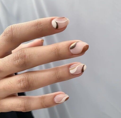 Abstract nail art to inspire your next manicure: Symmetrical Brown & White Pattern