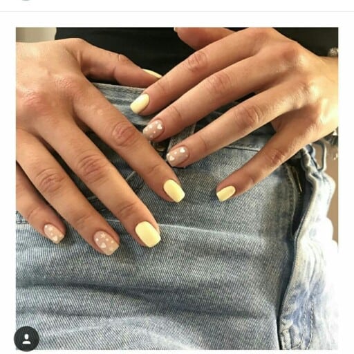 Trendy yellow nail designs for a sunny manicure: Nude Star Accents
