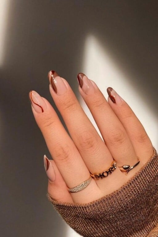 Abstract nail art to inspire your next manicure: Brown Nail Swirls