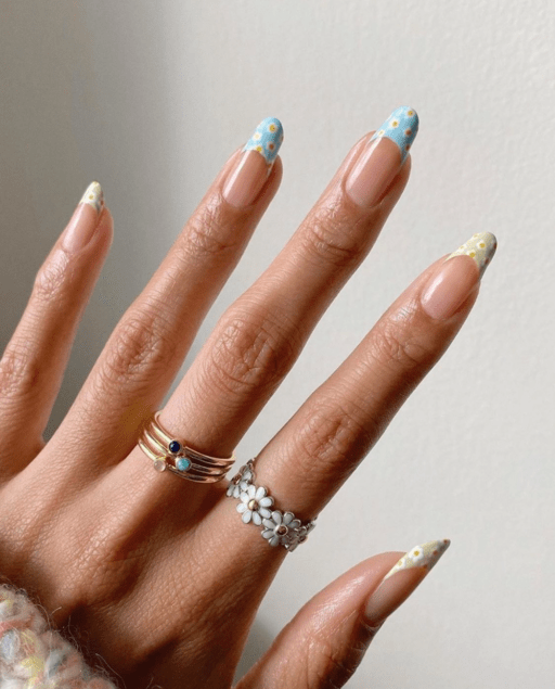 delicate and abstract flower nail art designs: Colored Tips With Daisies