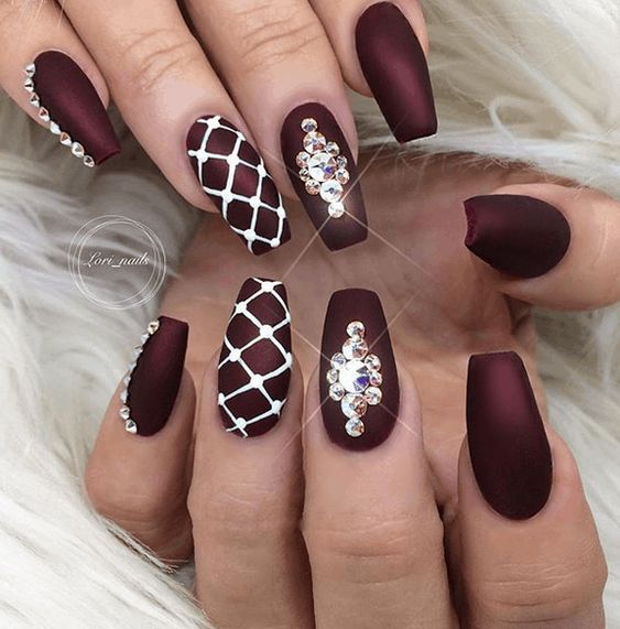 Closeup Of Woman Fingers With Nail Art Maroon Nail Polish High-Res Stock  Photo - Getty Images