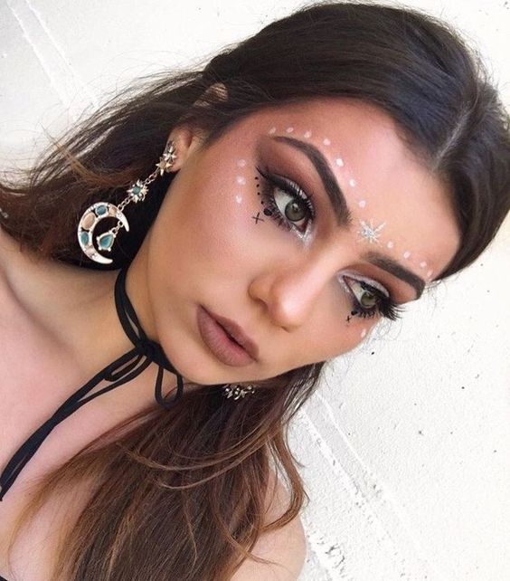 Festival makeup and festival looks, including festival glitter makeup, Coachella makeup, and more