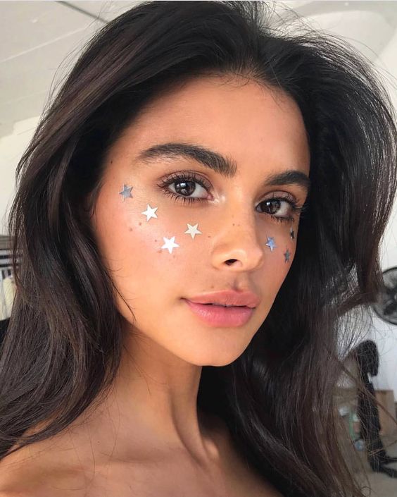 Festival makeup and festival looks, including festival glitter makeup, Coachella makeup, and more