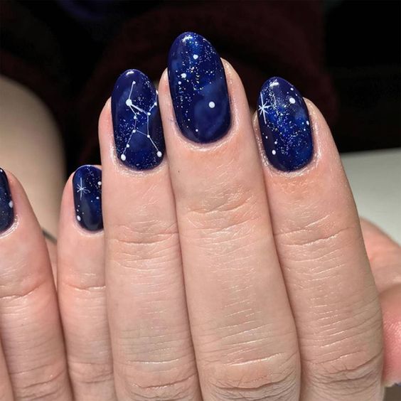 Galaxy nails, galaxy nail designs, and galaxy nail art for a gorgeous manicure