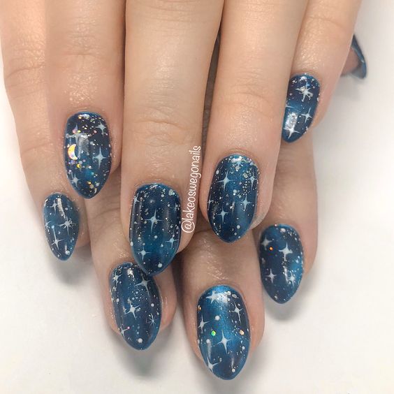 Galaxy nails, galaxy nail designs, and galaxy nail art for a gorgeous manicure