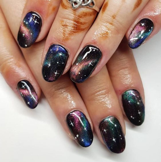 Galaxy nails, galaxy nail designs, and galaxy nail art for a gorgeous manicure