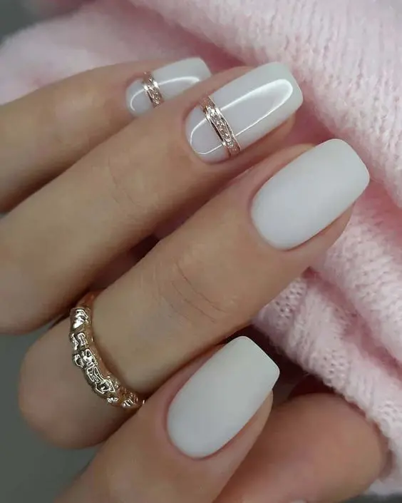 Milky nails with gold swirls | White nails with gold, White acrylic nails,  Cream nail designs