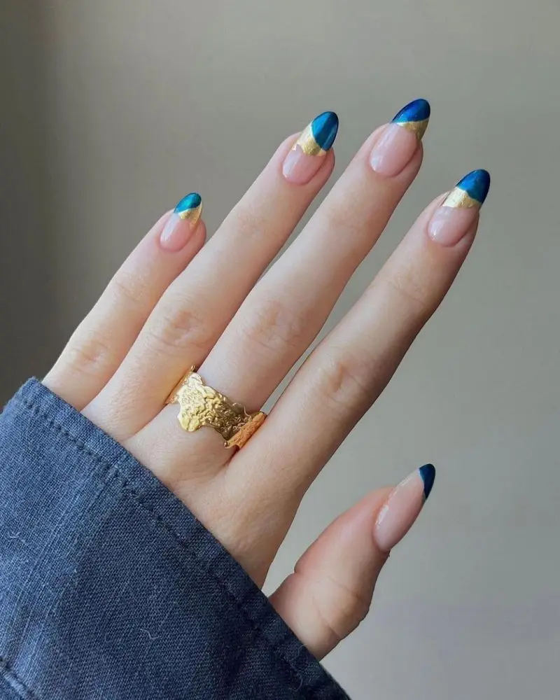 Royal-Blue-and-Nude-Nails-with-Studded-Leaves-Detail |