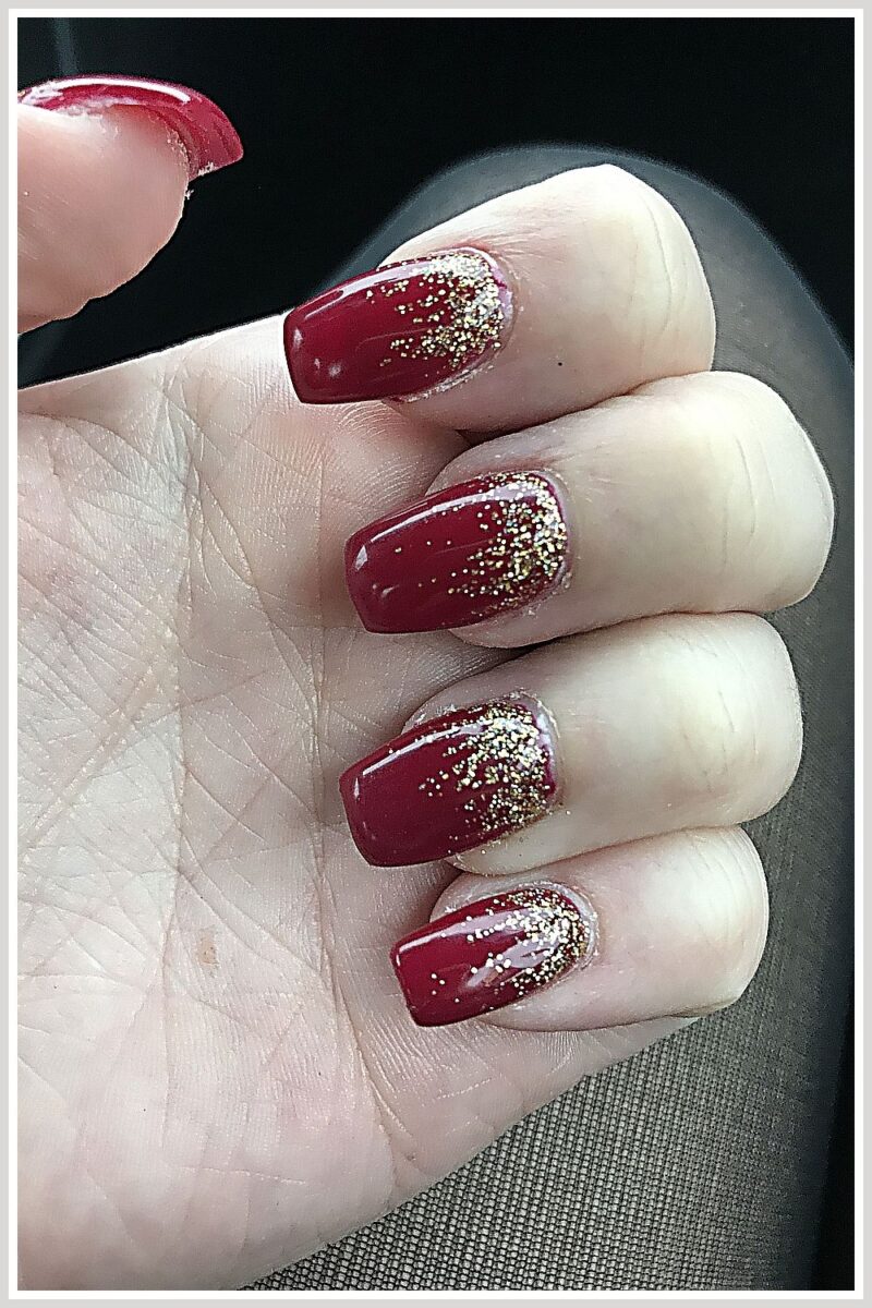 dark red nails with gold